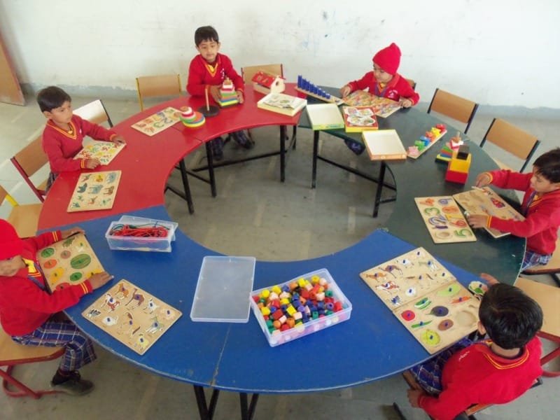 Preschool children engaged in hands-on learning activities at PRJ Gyanjaya School