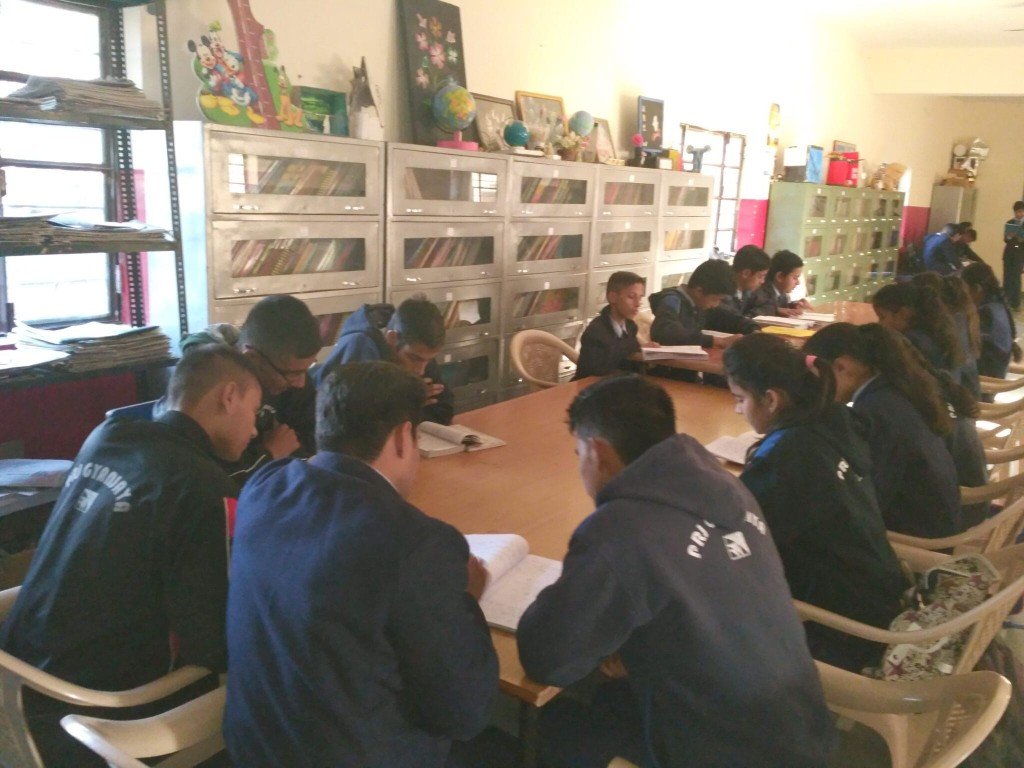 Secondary students studying in the library at PRJ Gyanjaya School